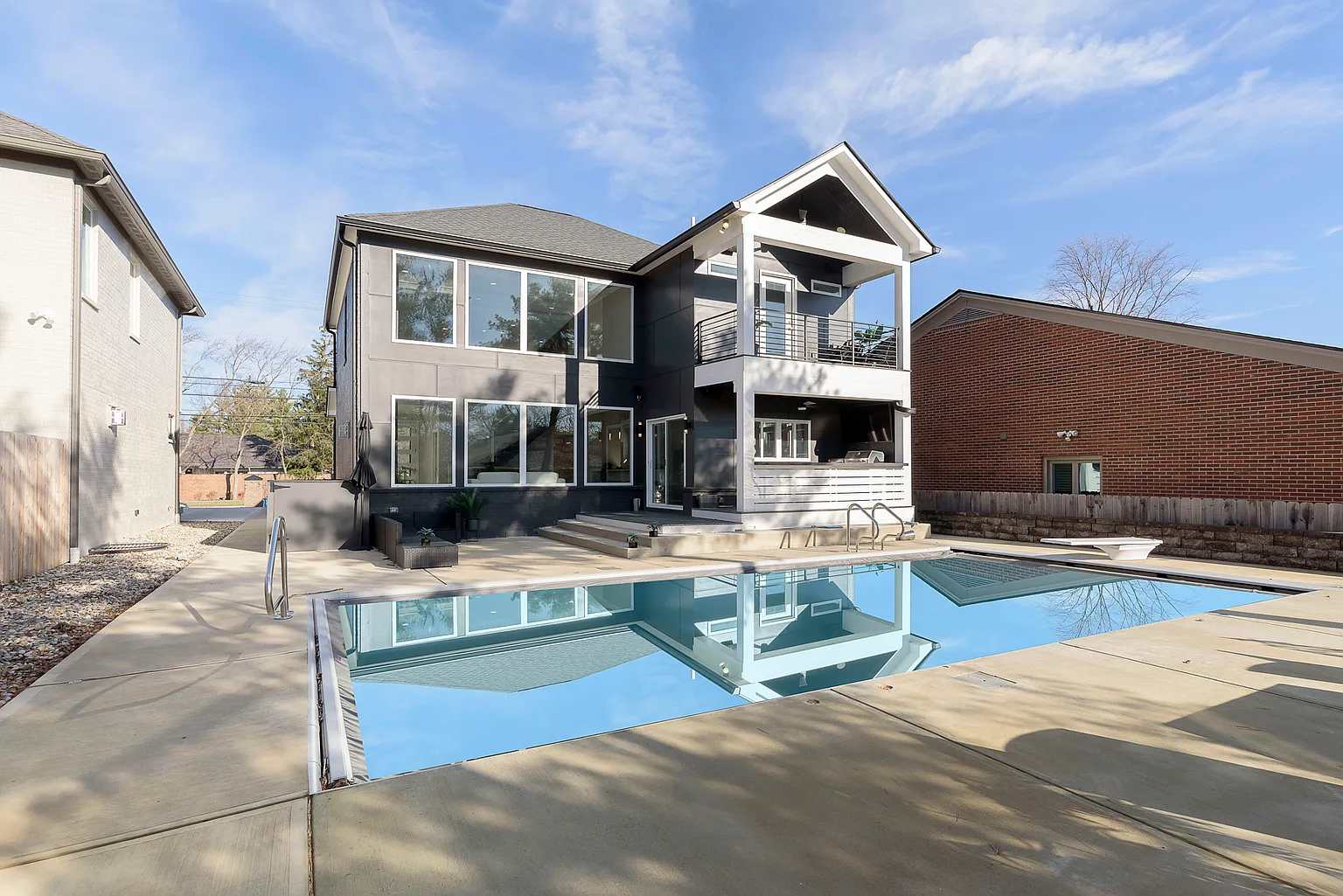 Luxury Ohio short-term rental home with mansion backyard pool and outdoor entertaining space