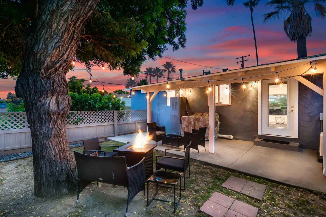 San Diego backyard with fire pit seating area and guest house showing airbnb co host responsibilities for property management