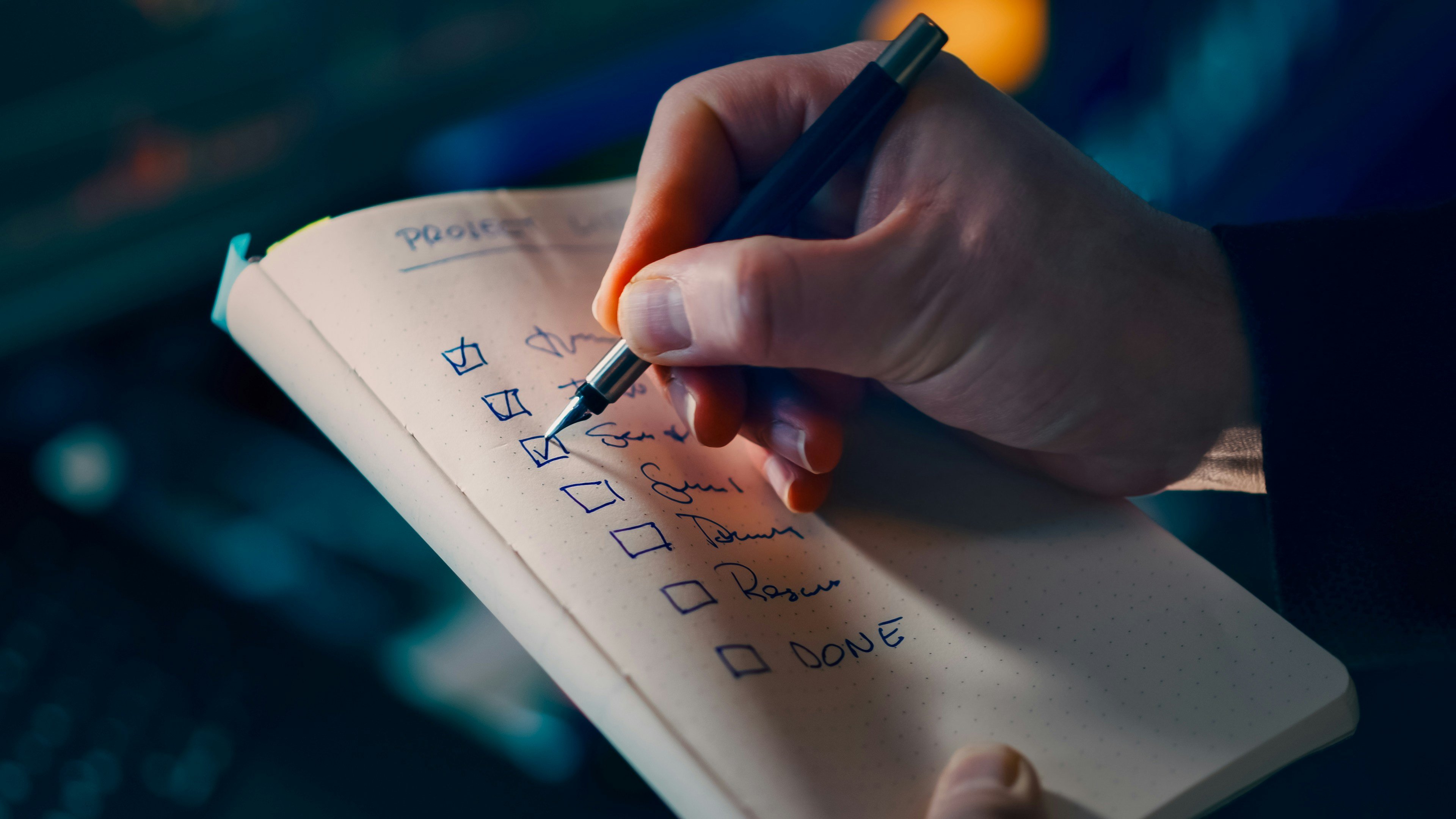 Hand checking off items on a list