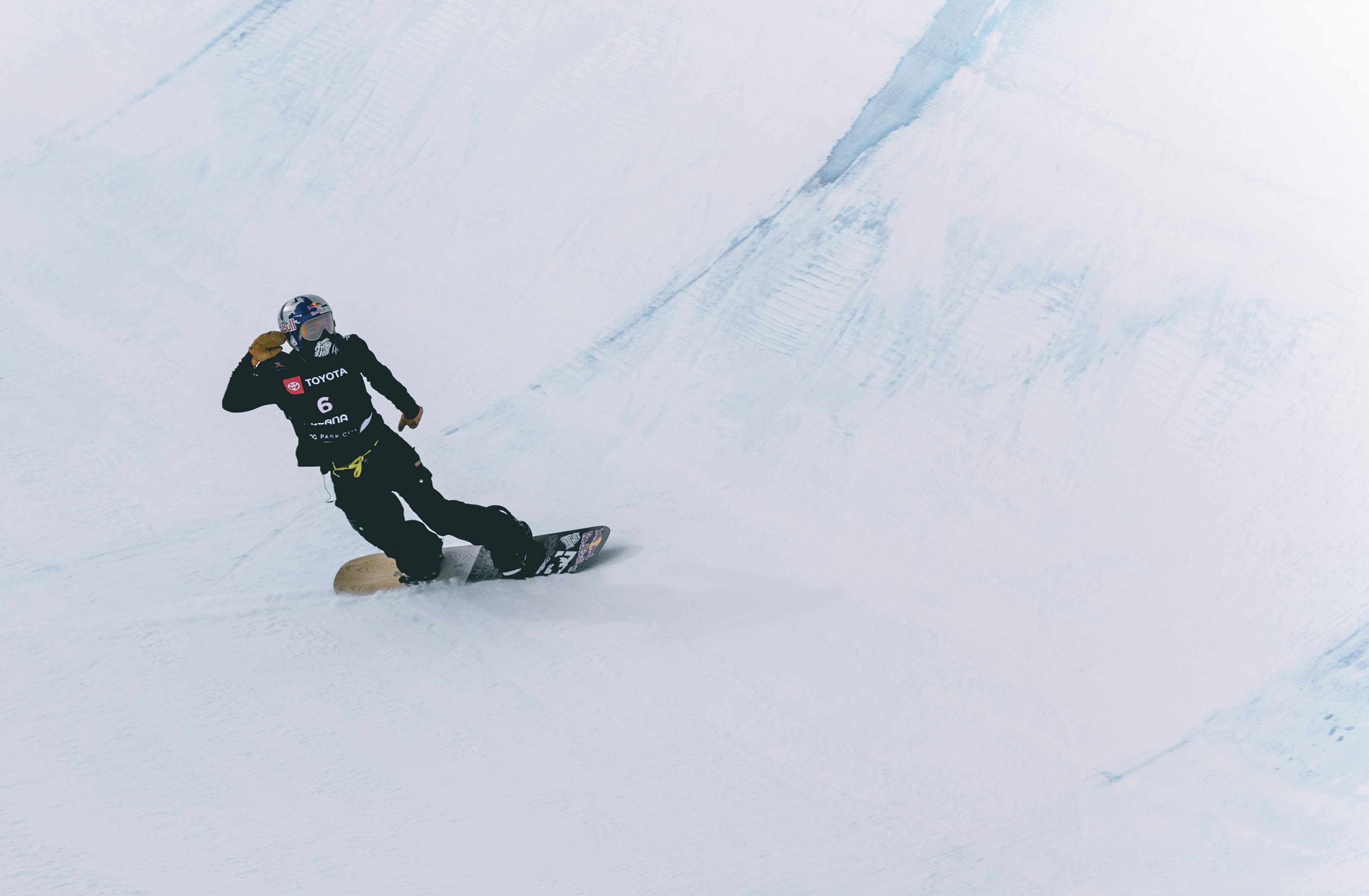Snowboarder riding down a slope