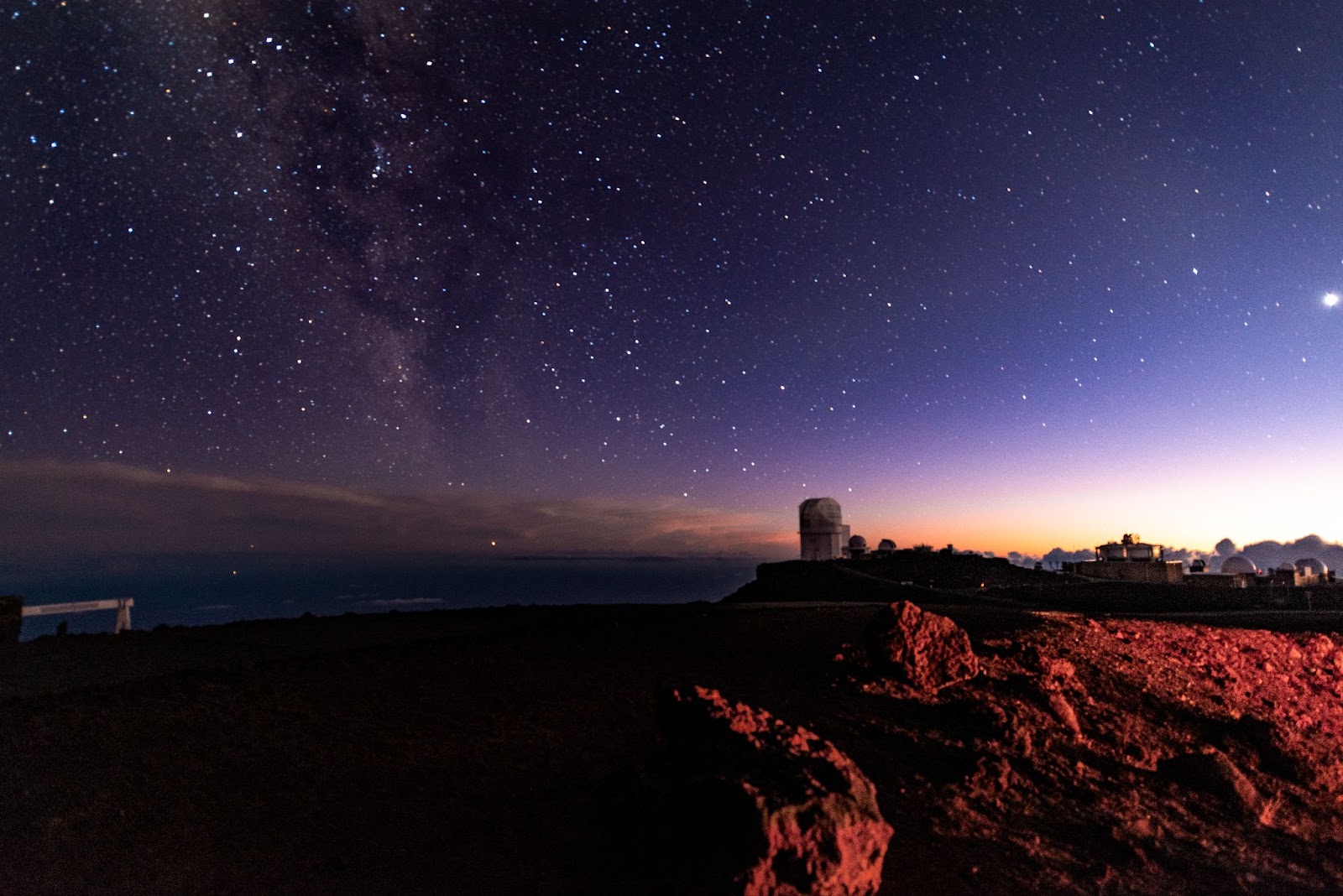 Colourful starry night scene at Haleakala Volcano Summit Observatory