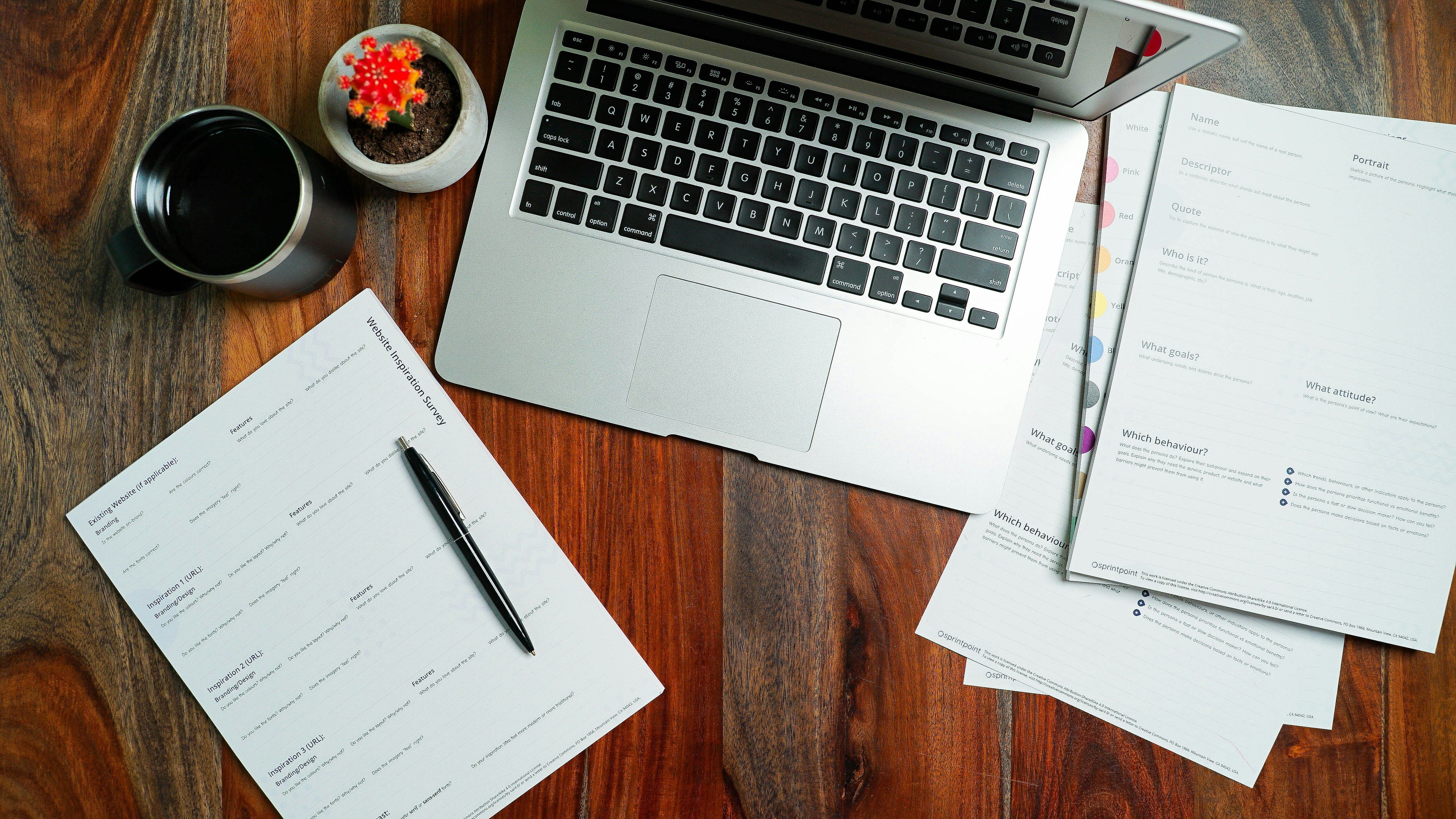 Laptop and rental paperwork on a desk