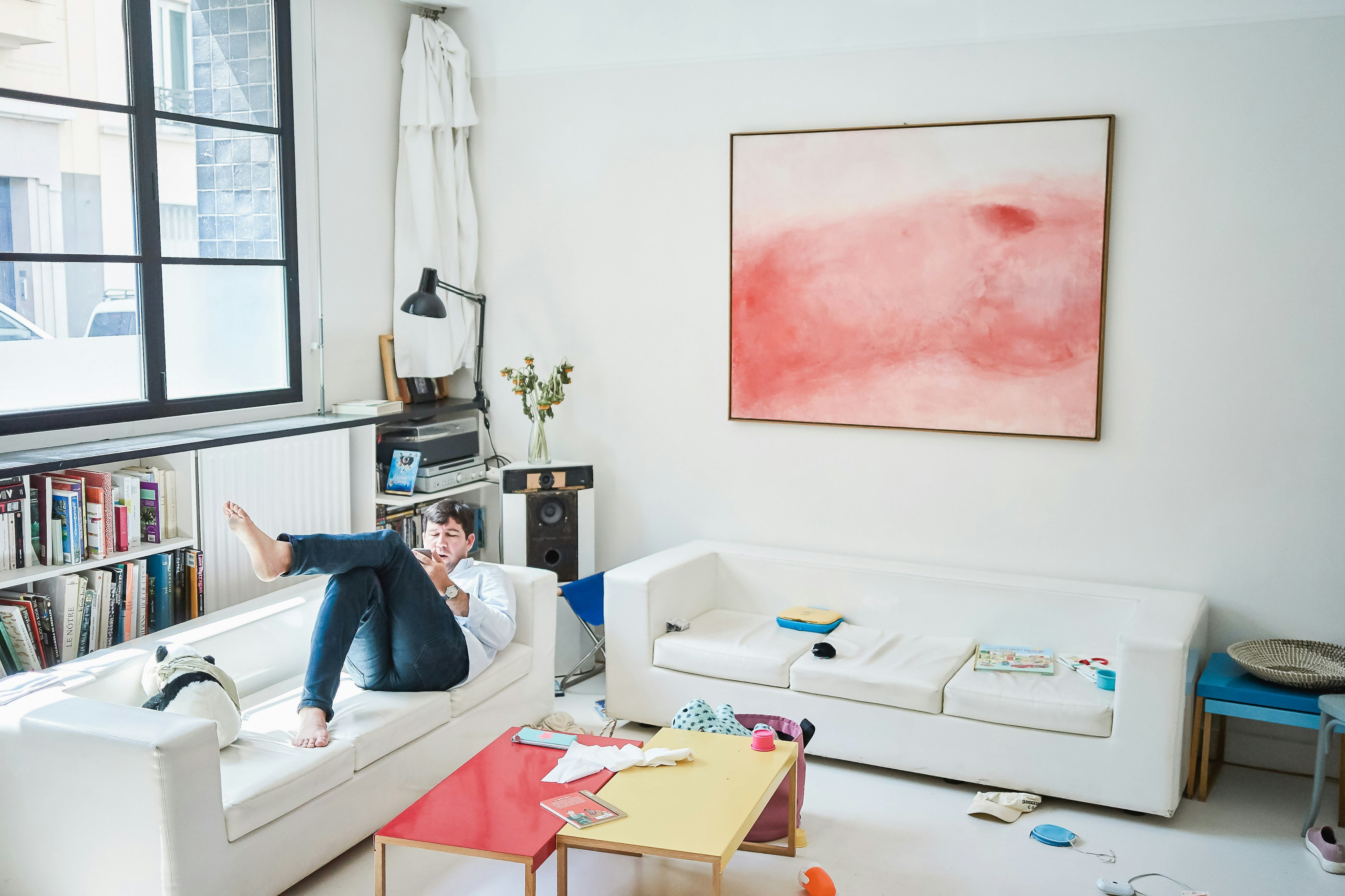 Person settled in on the couch in a furnished apartment