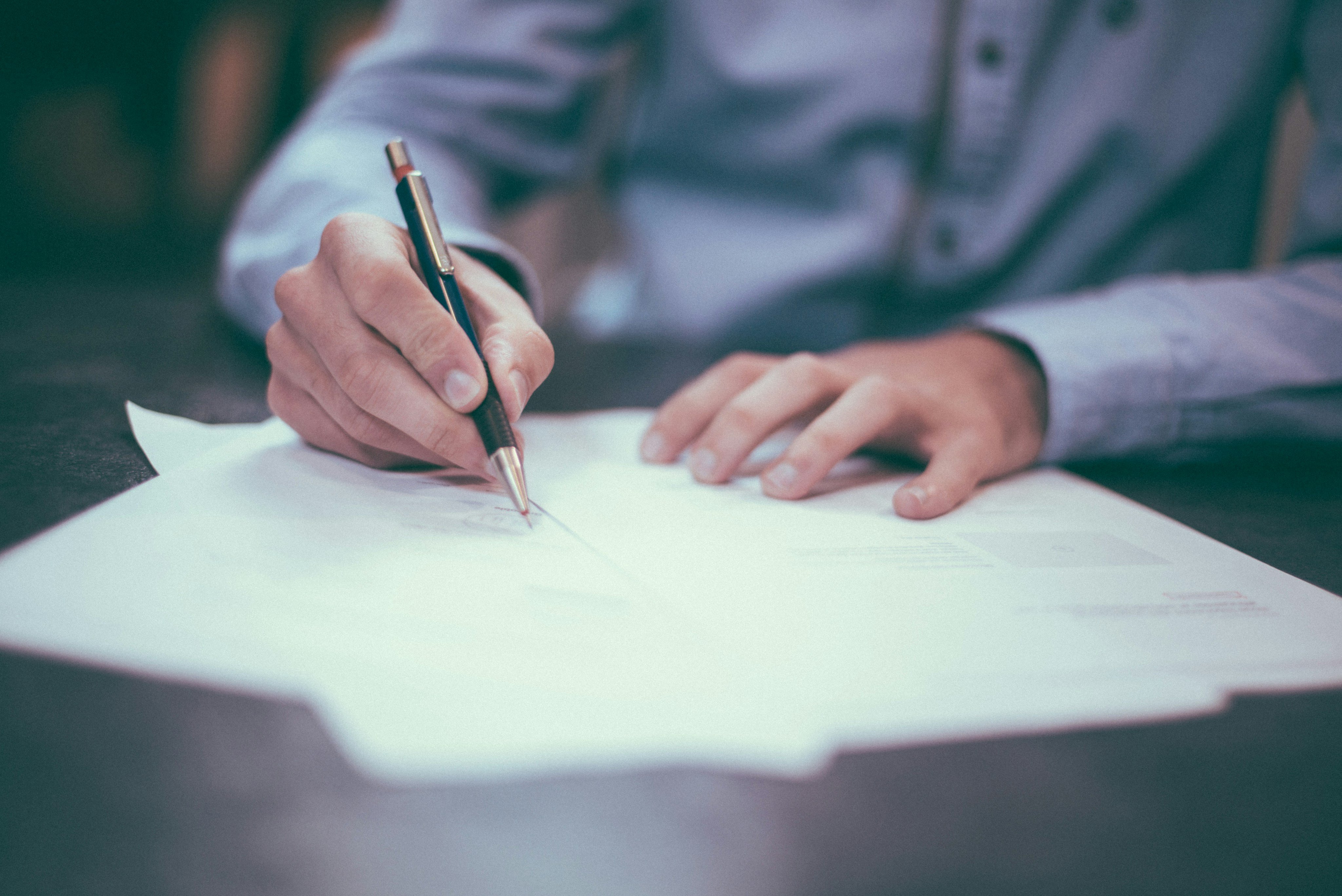 Person signing an apartment lease