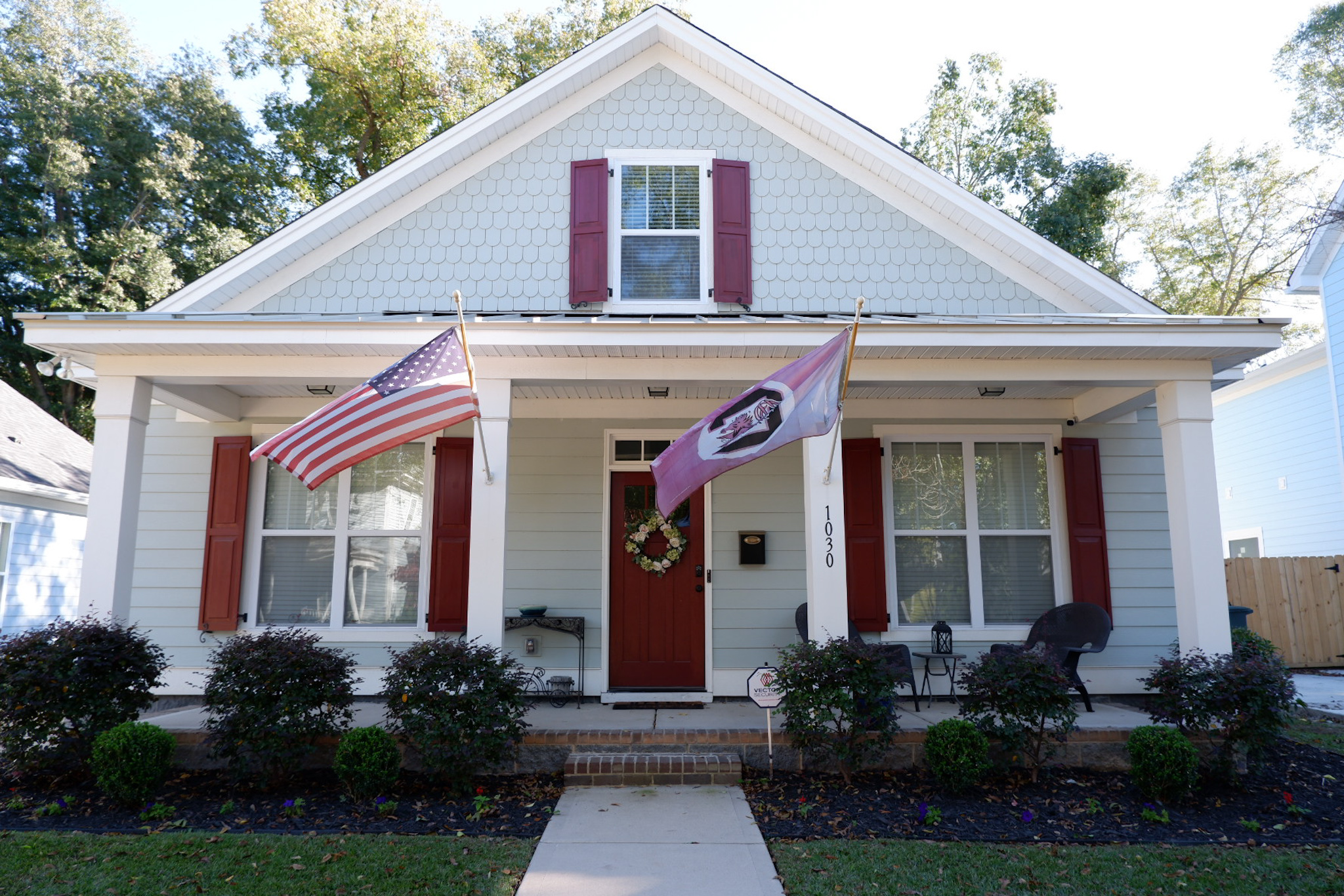 Charming Columbia SC home exterior with American and South Carolina flags
