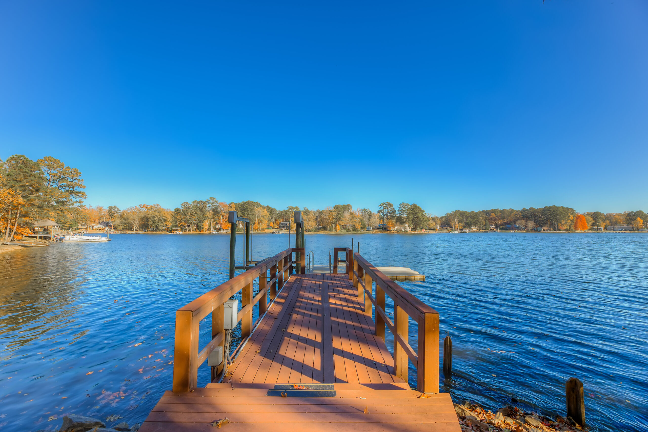 Lake Murray dock in autumn with calm blue water