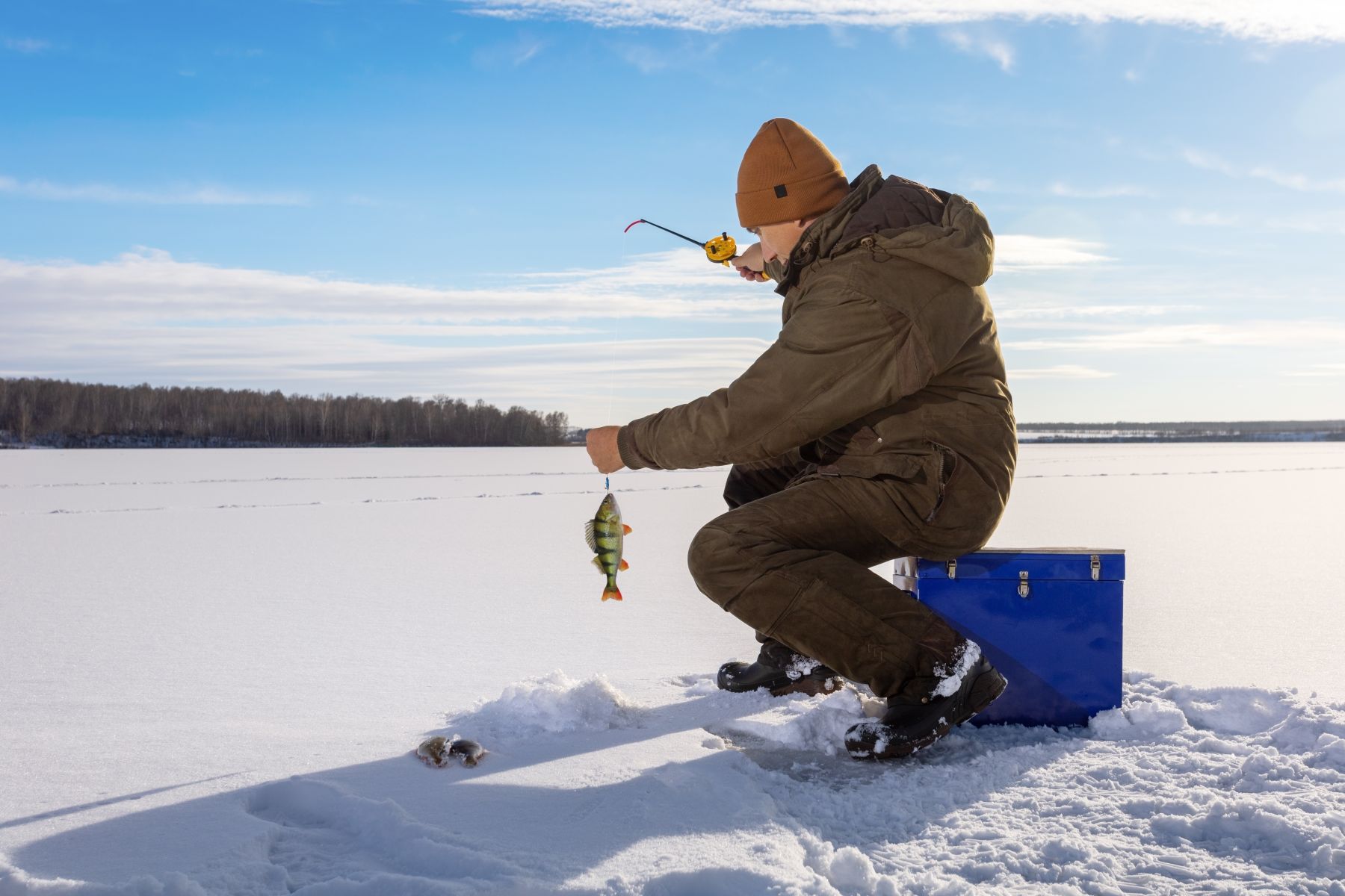 man ice fishing