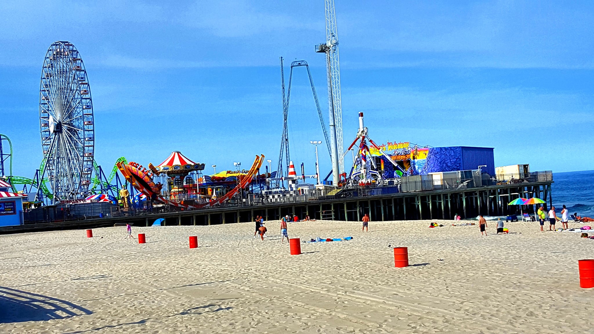 Seaside Heights Casino Pier and Hydrus roller coaster against a blue sky, illustrating a Jersey