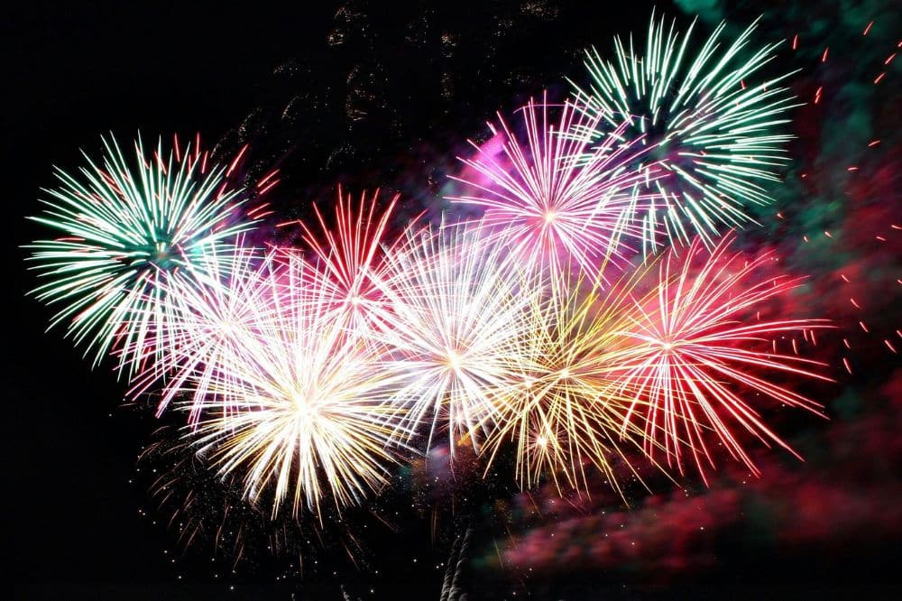 Colorful fireworks bursting in the night sky, symbolizing family-friendly celebrations at Jenkinson's Boardwalk, Jersey Shore.