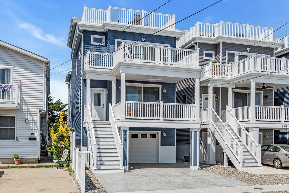 Coastal multi-family home in Seaside, New Jersey, showcasing modern architecture, balconies, and proximity to neighboring properties, reflecting investment potential in the Jersey Shore real estate market.