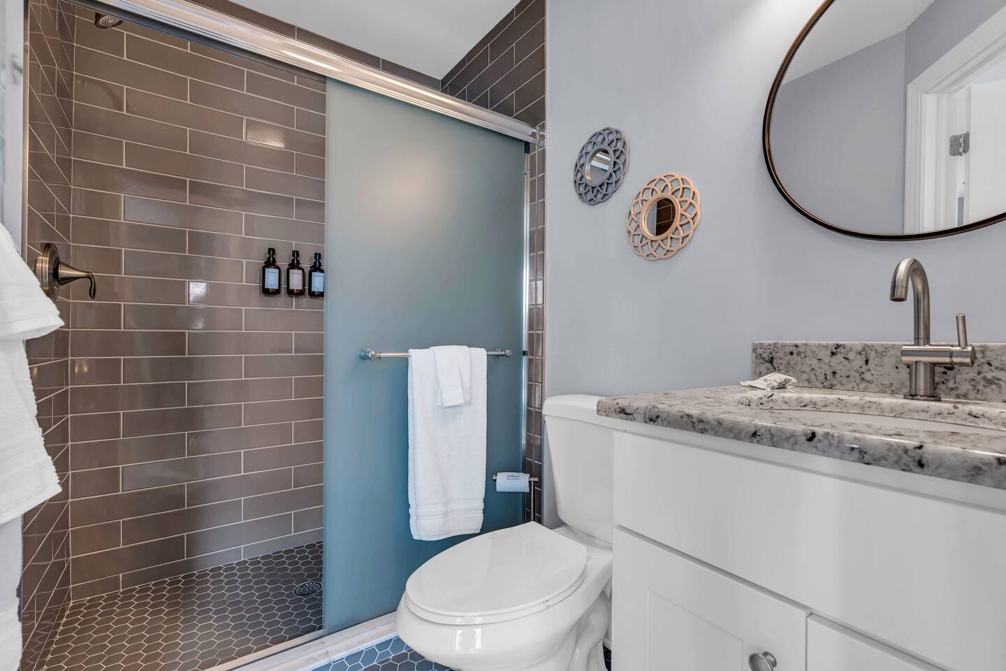 Clean Jersey Shore vacation rental bathroom with glass shower and modern fixtures.