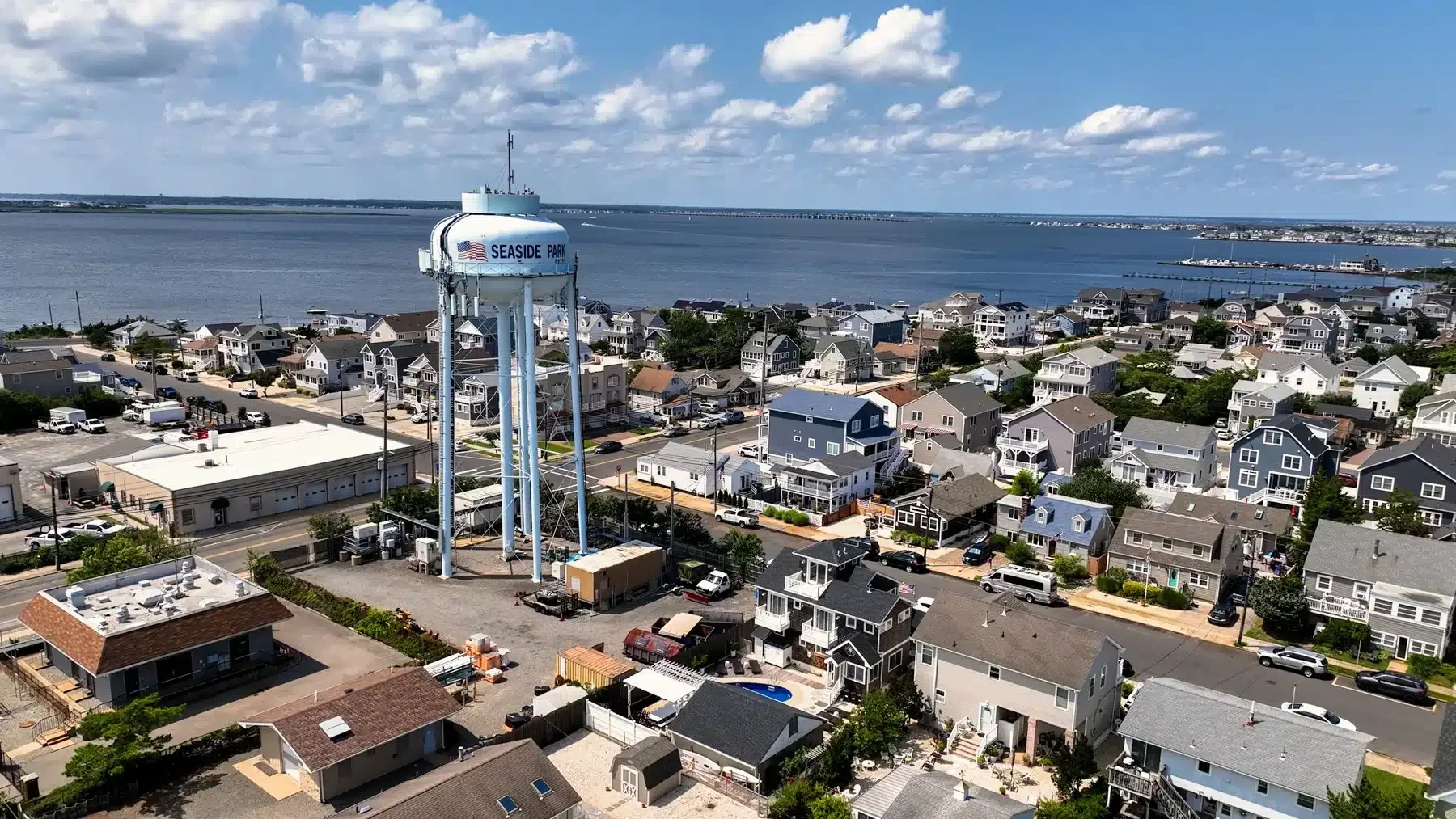 Aerial view of Seaside Park showcasing residential homes, water tower, and coastline.