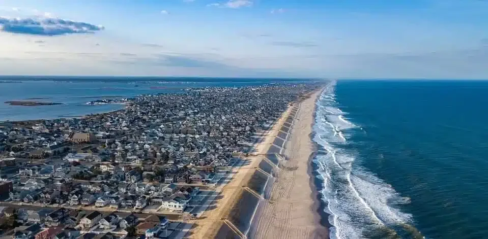 Aerial view of Lavallette's coastline showcasing residential homes along the beach.