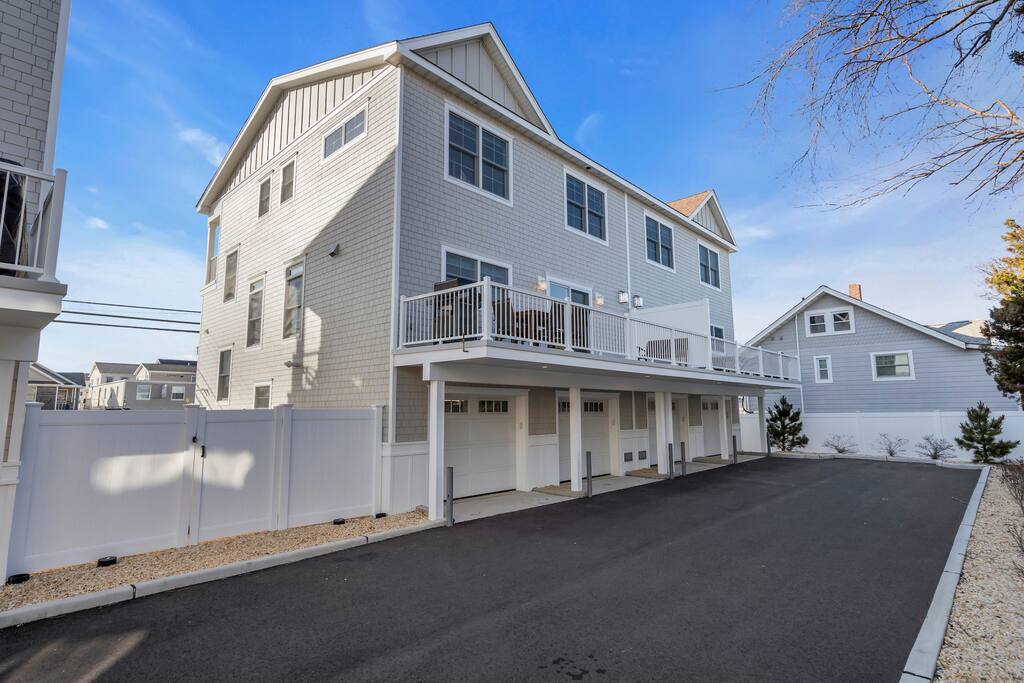 Breezy 3-bedroom coastal rental with outdoor parking, modern design, and proximity to Jersey Shore beaches.
