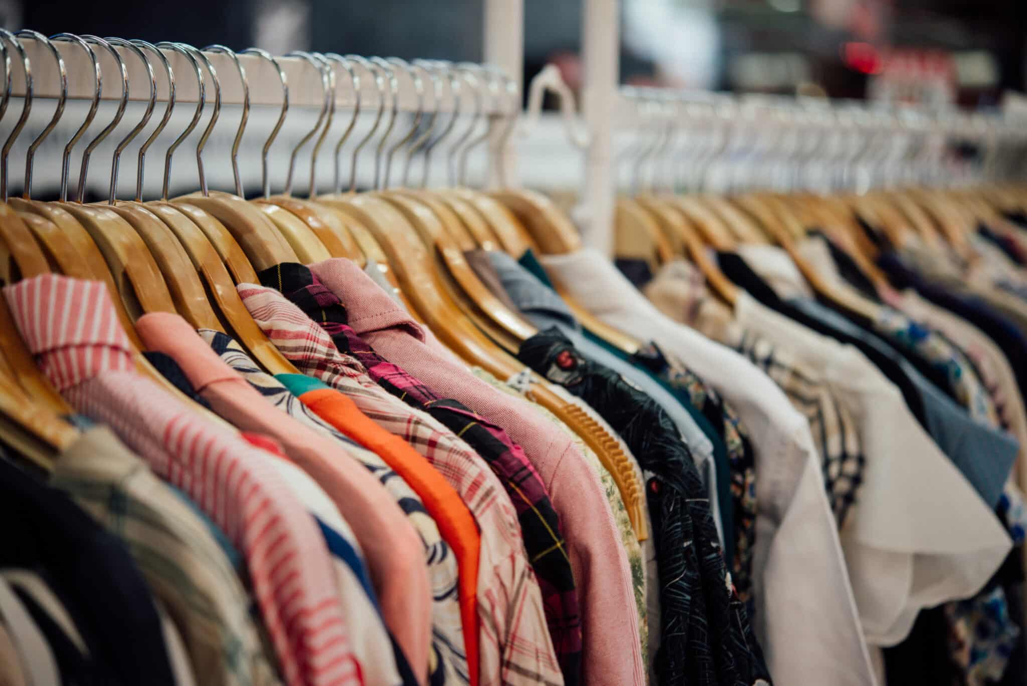 Clothing rack featuring a variety of colorful shirts and blouses, showcasing options for beach vacation outfits and casual dining at the Jersey Shore.