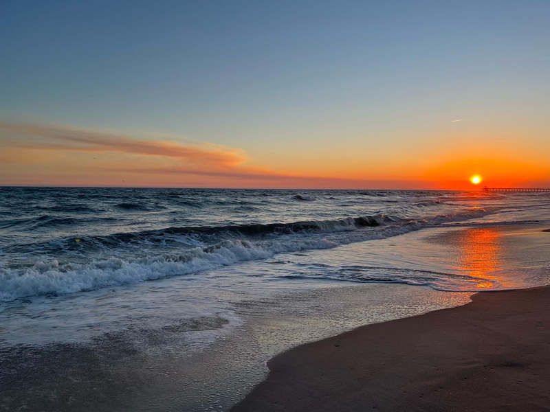 View of the ocean and beach at sunset