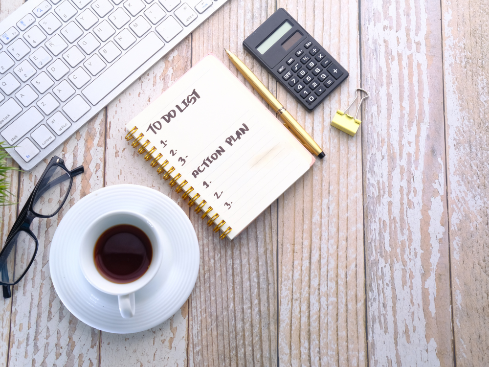 coffee cup with notepad by a computer keyword