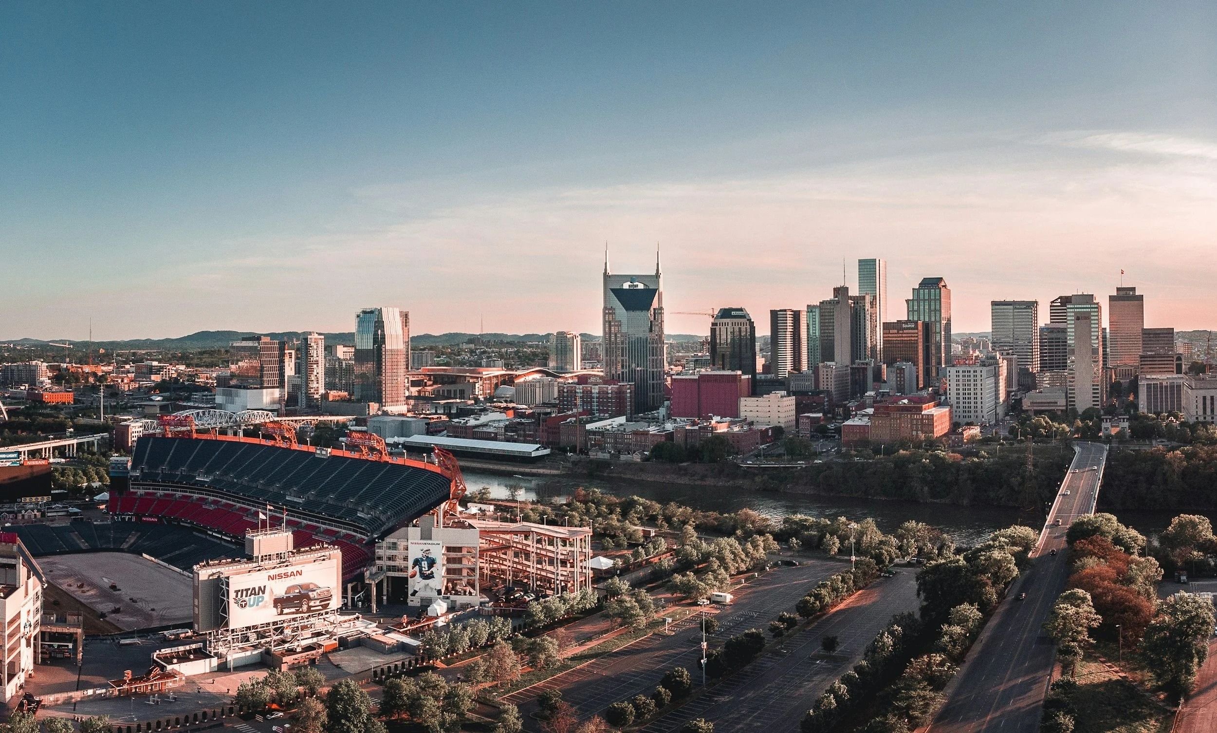 Aerial view of the Nashville skyline, river, and stadium.