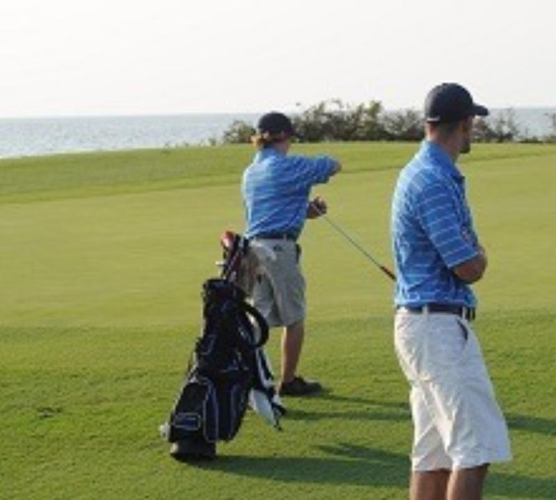 golfers on the golf course on the waterfront