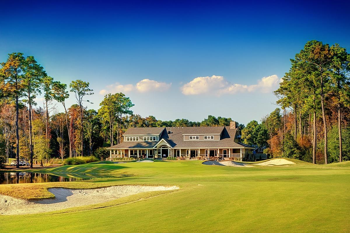 a clubhouse on a golf course