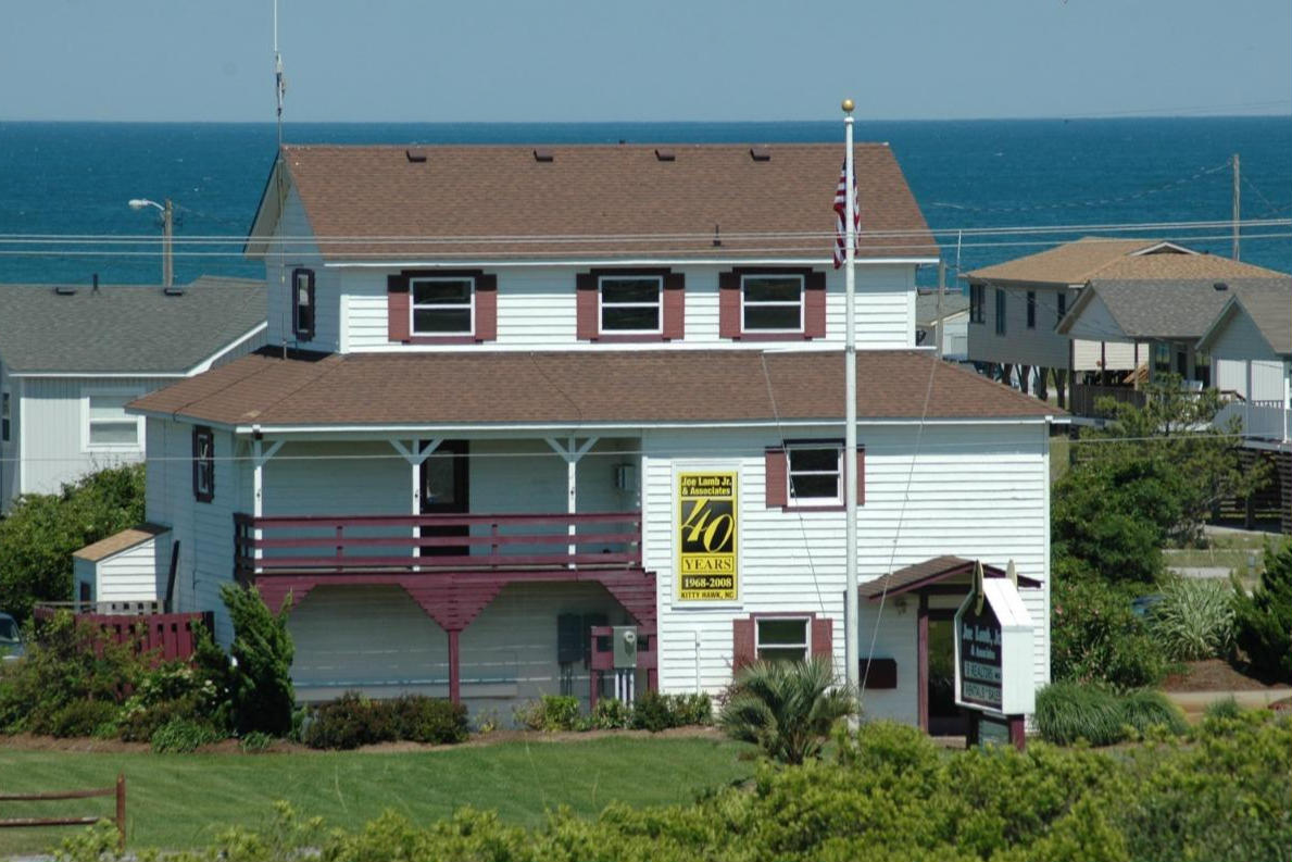 a building with ocean in the background