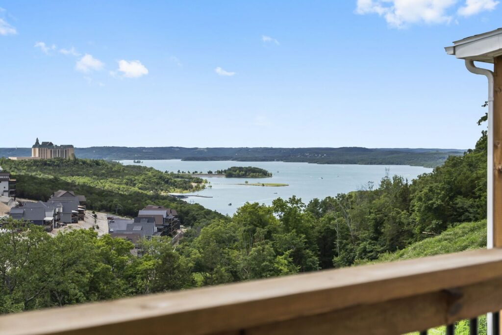 View from a Branson vacation rental deck across wooded hills to Table Rock Lake