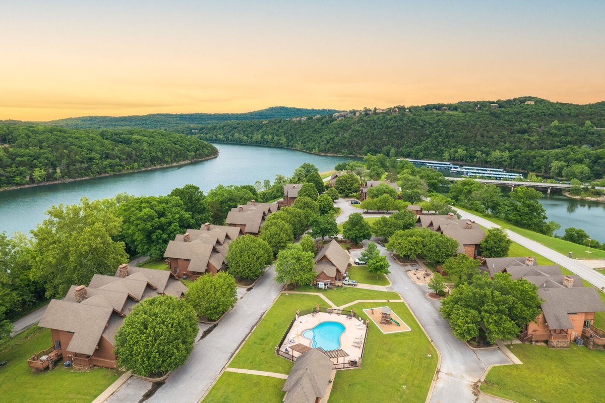 Aerial view of Table Rock Landing lake condos near Branson, with the Table Rock Lake channel and a marina behind them