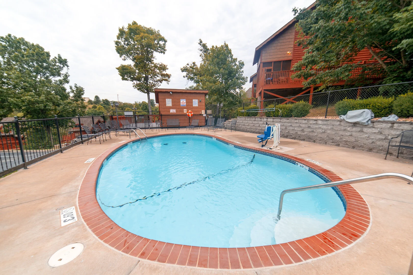 Cabin amenities including hot tub, deck, and Ozark Mountain views