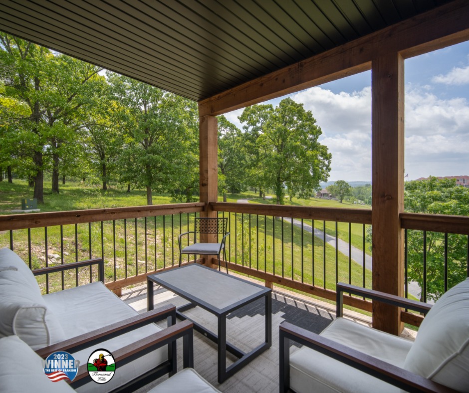 A charming porch adorned with stylish furniture, overlooking breathtaking mountain scenery.