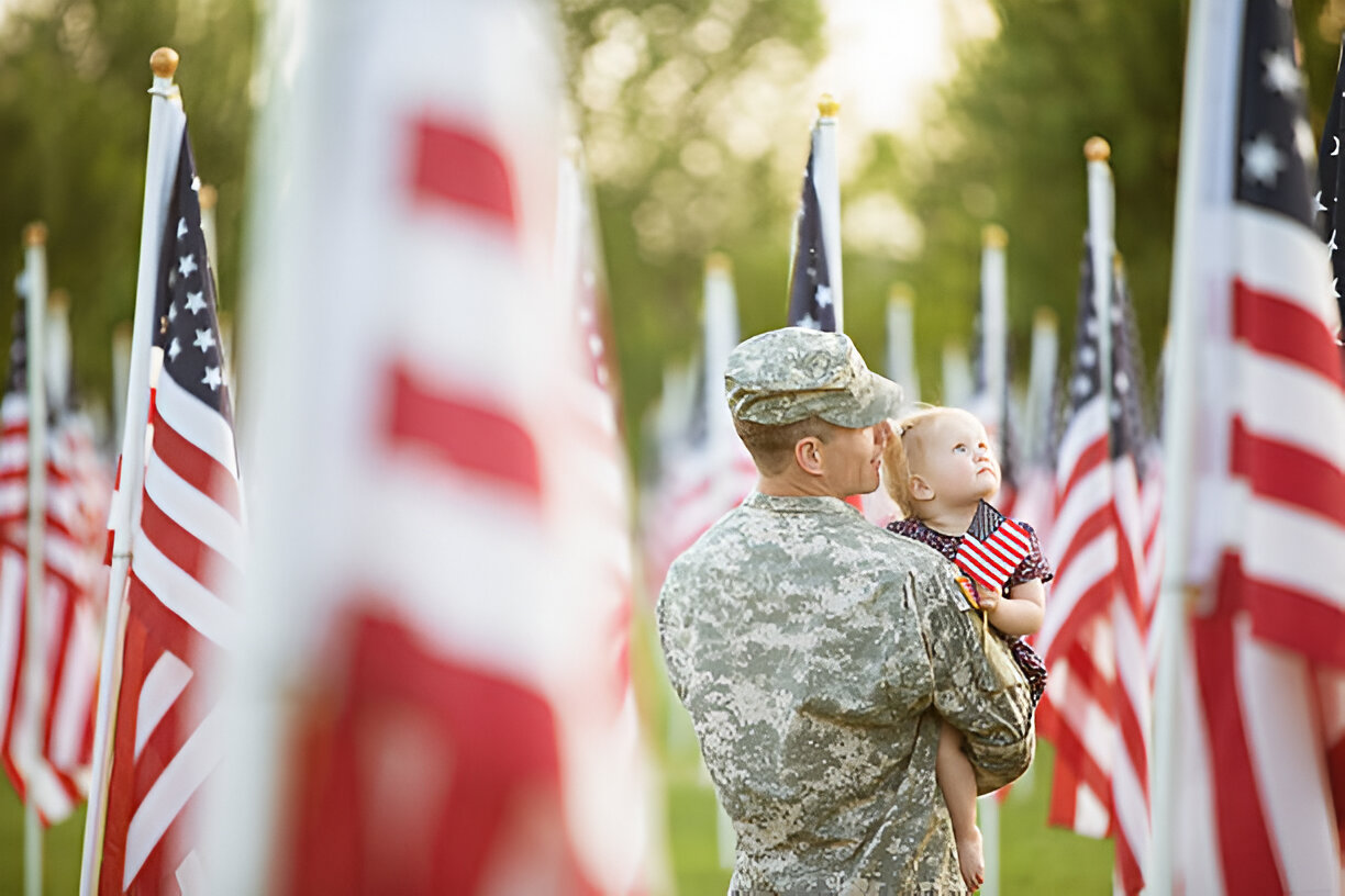 American flags mark graves in tribute to fallen soldiers on Memorial Day