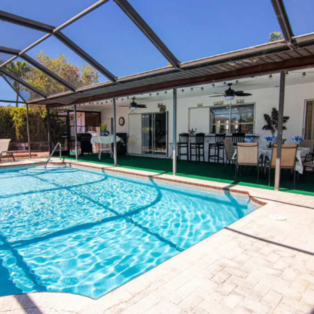 Coastal Coral Paradise screened lanai and tropical landscaping Cape Coral