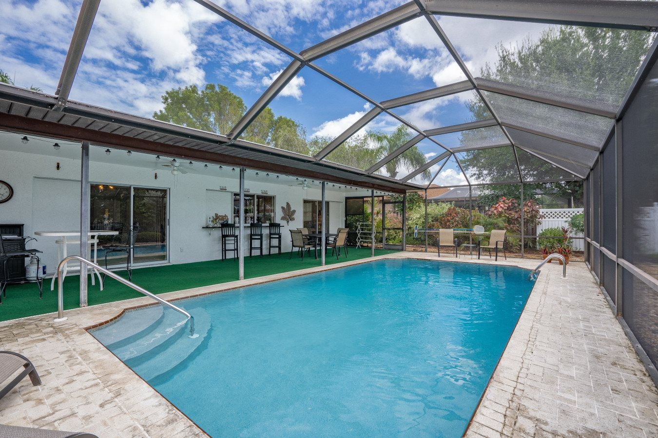 Coastal Coral Paradise heated pool and screened lanai Cape Coral vacation home
